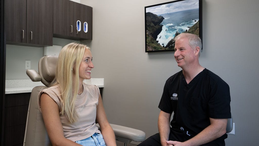 Dr. Cherry consulting with a patient at Cherry Orchard Oral & Implant Surgery